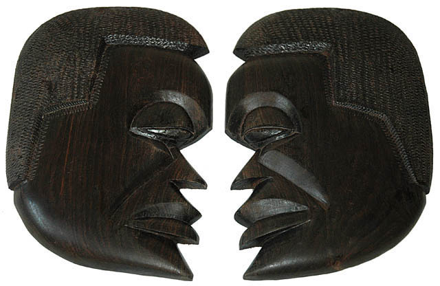 Hand carved side masks in Ebony